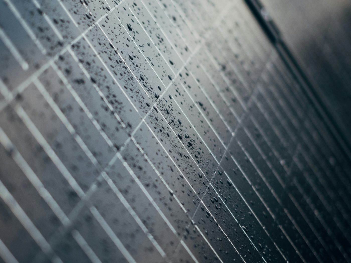 Close-up of a solar module surface with water droplets after washing
